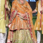Burnt Orange Raw Silk Pishwas with Green Lehenga and Embellished Dupatta
